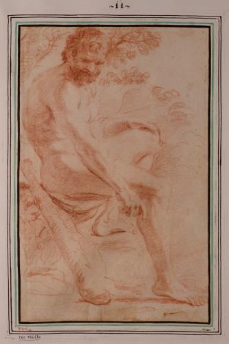 Estudio de modelo masculino como Hércules sentado señalado al suelo