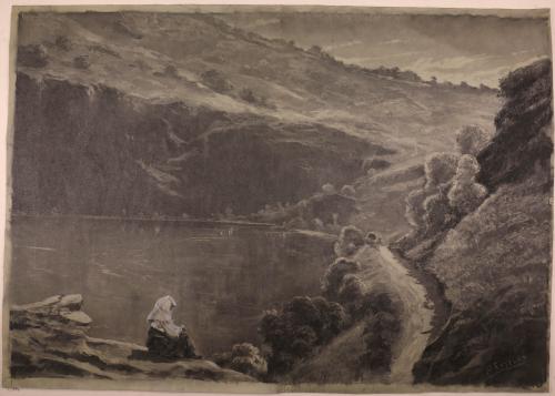 Mujer sentada junto al lago