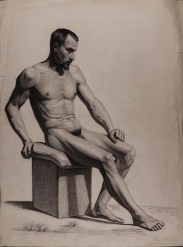 Estudio de modelo masculino sentado apoyado en su brazo derecho